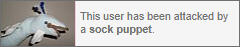 WHITE USERBOX THAT READS "THIS USER HAS BEEN ATTACKED BY A SOCK PUPPET." THERE IS AN IMAGE OF A SOCK PUPPET ON THE LEFT SIDE.